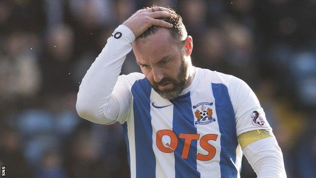 Kris Boyd holds his head