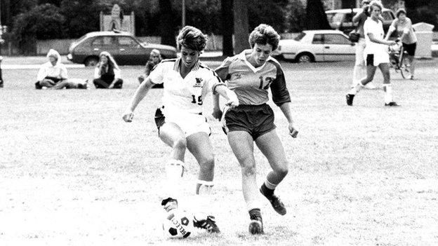 Jill Ellis playing football in her younger days