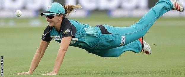 Kate Cross dives for the ball during a Women's Big Bash League game