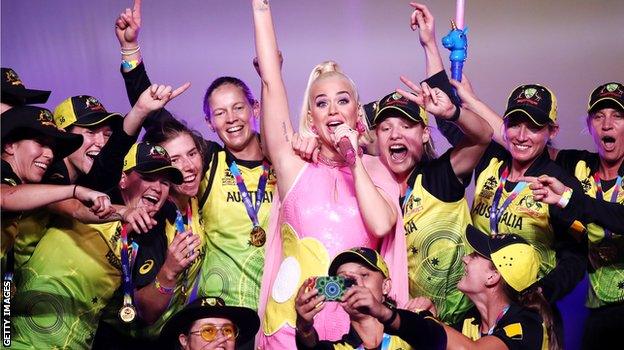 The Australia team joins Katy Perry on stage after the final