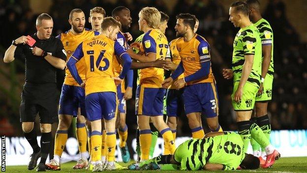 Mansfield's George Lapslie was shown the red card on 49 minutes for his challenge on Forest Green's Ebrima Adams