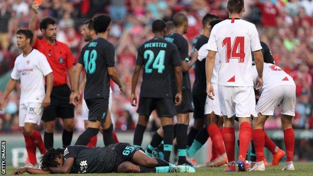 Yasser Larouci lies on the floor as Joris Gnagon is sent off