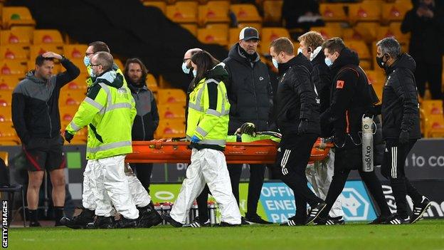 Wolves keeper Rui Patricio is carried off on a stretcher after sustaining a head injury against Liverpool