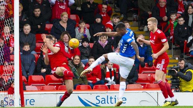 Rangers' Alfredo Morelos sees his shot blocked by Andrew Considine of Aberdeen