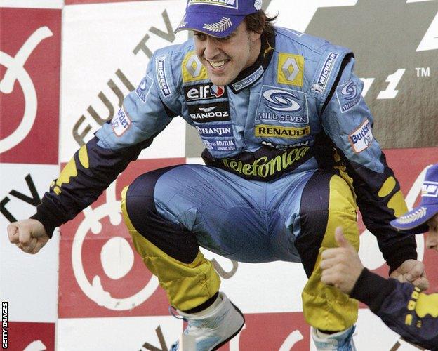 Fernando Alonso celebrates winning the 2006 world championship at Japan