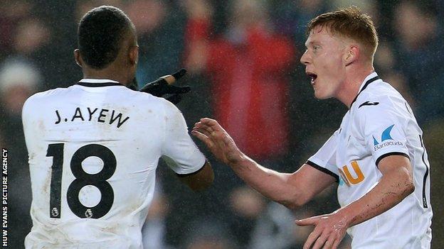 Swansea goal-scorers Jordan Ayew and Sam Clucas celebrate against Arsenal