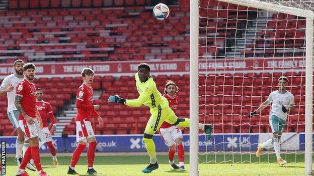 Nottingham Forest keeper Brice Samba watches on as a strike by Bournemouth's Junior Stanislas goes just wide