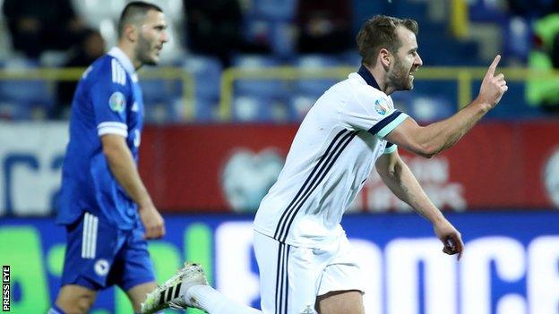 Niall McGinn celebrates after netting the second-half equaliser in Sarevejo