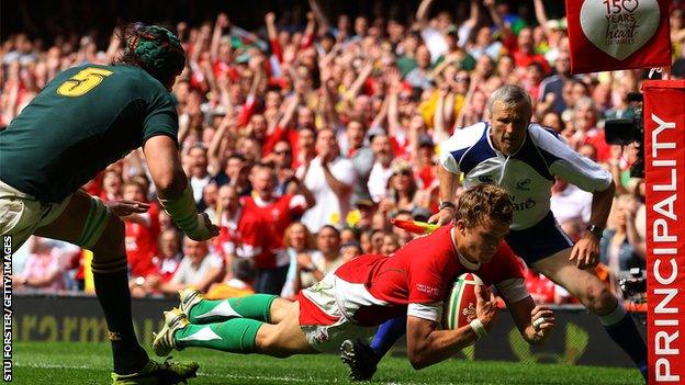 Wales winger Tom Prydie (r) is congratulated after scoring in the corner during the International Friendly match between Wales and South Africa at Millennium Stadium on June 5, 2010 in Cardiff, Wales