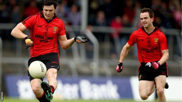 Marty Clarke and Mark Poland in action for the Mourne team in 2011