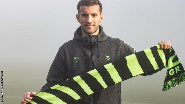 Baily Cargill poses with a Forest Green scarf