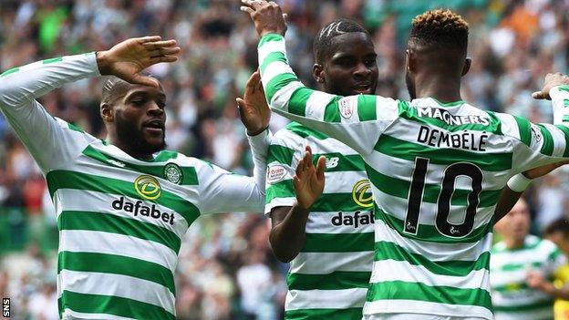 Moussa Dembele (right) celebrates his first goal