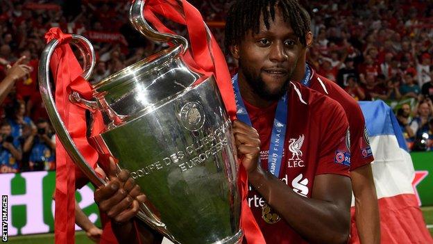 Divock Origi with the Champions League trophy, 2019.