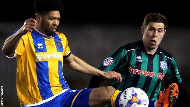 Grant Holt (right) in action for Rochdale