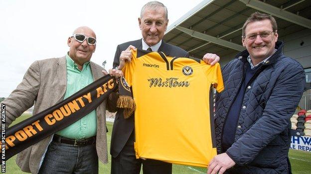 Les Scadding, Terry Butcher and Howard Greenhaf with a Newport County shirt on the Rodney Parade pitch