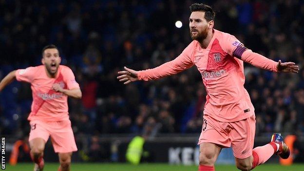 Lionel Messi celebrates scoring the opening goal for Barcelona against Espanyol in La Liga