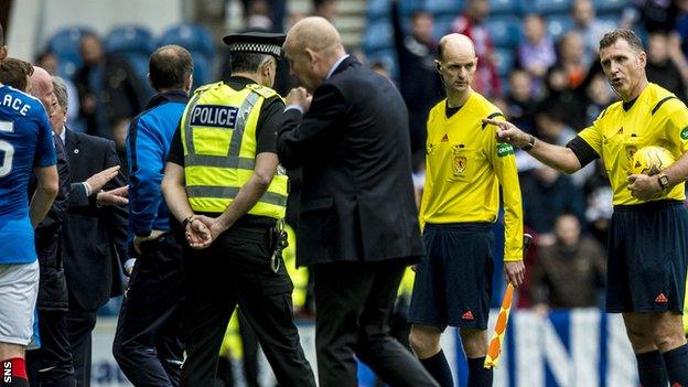 Peter Houston heads up the tunnel at Ibrox after the 3-1 defeat