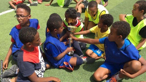 Children with a trophy at the Somaliland Football Academy