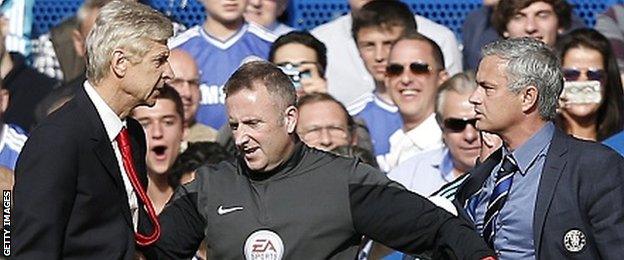 Arsenal manager Arsene Wenger (left) and Chelsea boss Jose Mourinho are kept apart by the fourth official during a Premier League game in October 2014