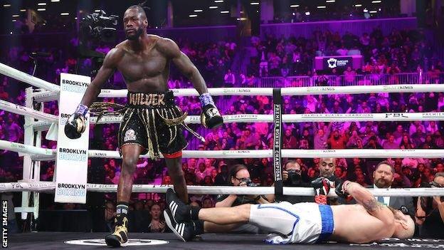 Deontay Wilder walks away after knocking out Robert Helenius