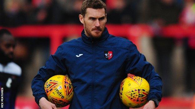 Exeter coach Matt Taylor oversees a warm-up