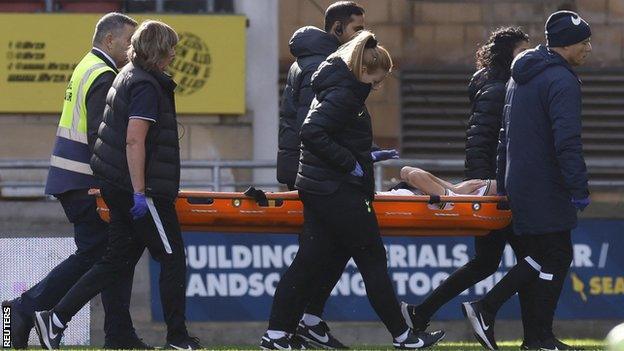 Tottenham Hotspur's Ellie Brazil is stretchered off after sustaining an injury