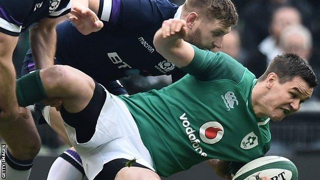 Finn Russell and Johnny Sexton clash during the Six Nations