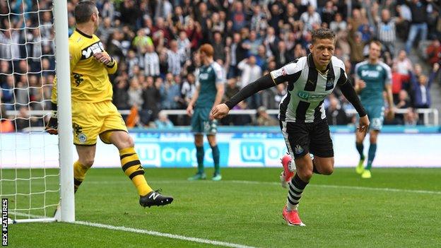 Dwight Gayle opens the scoring for Newcastle against Wigan