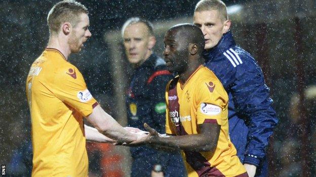 Stephen Pearson (left) is replaced by Morgan Gomis in Motherwell's win over Dundee United on Friday