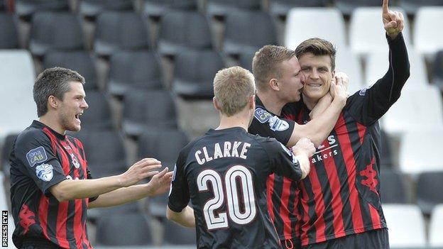 Diarmuid O'Carroll celebrates scoring the opener for Crusaders