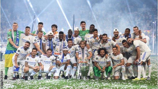 Real Madrid celebrate with the Champions League trophy