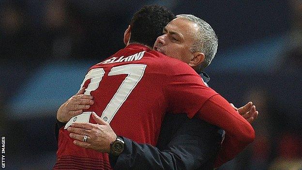 Marouane Fellaini hugs Jose Mourinho