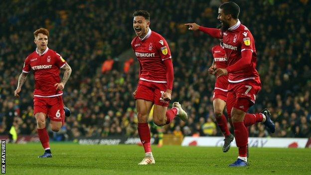 Matty Cash (centre) celebrates his first-half goal against Norwich
