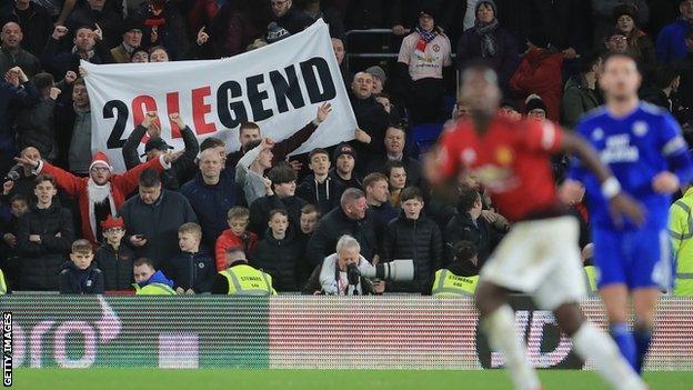 Ole Gunnar Solskjaer banner, with Paul Pogba in the foreground