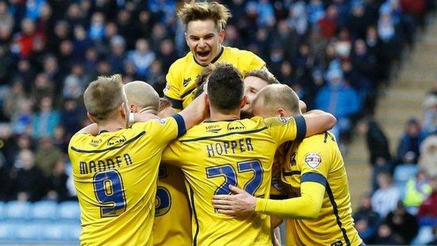 Scunthorpe United celebrate Murray Wallace's match-clinching second goal in the 2-1 win against Coventry City at the Ricoh Arena