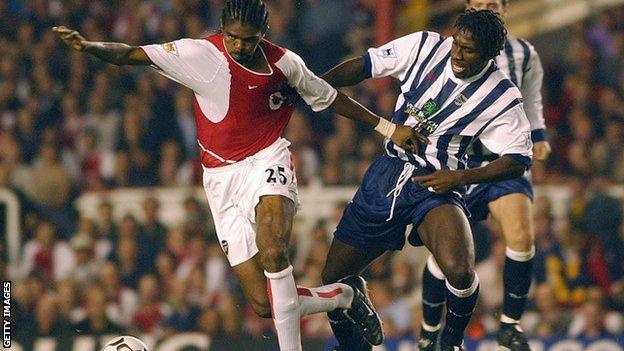 Darren Moore (right) tussles with Arsenal striker Kanu