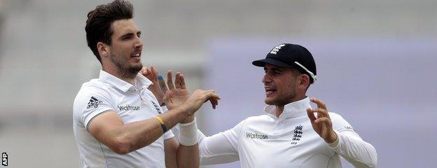 Steven Finn celebrates a wicket with Alex Hales