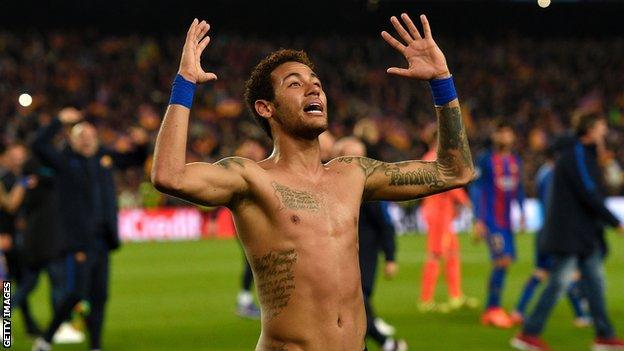 Neymar celebrates while a Barcelona player