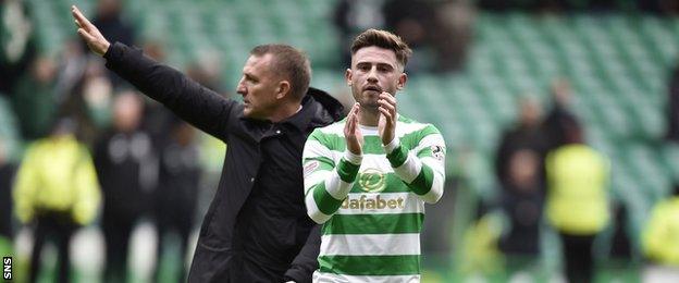 Patrick Roberts and Brendan Rodgers applaud the Celtic supporters