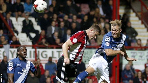 Michael Morrison heads Birmingham's opening goal at Brentford