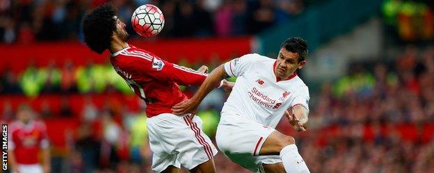 Marouane Fellaini (L) and Dejan Lovren (R)