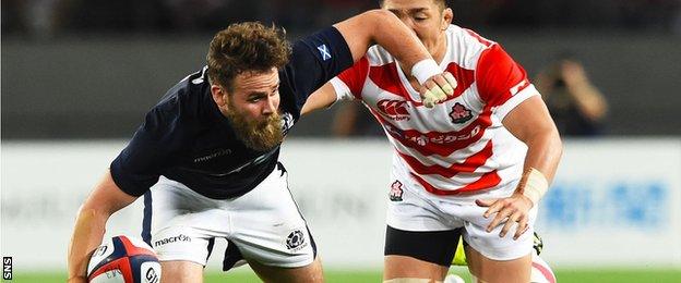 Scotland's Ruaridh Jackson (left) in action against Japan