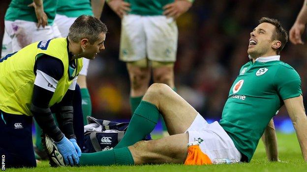 Tommy Bowe receives treatment seconds after coming on as a replacement against Wales