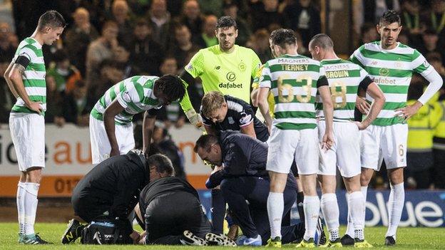 Dundee midfielder Randy Wolters receives treatment against Celtic