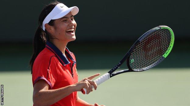 Emma Raducanu laughing during practice.