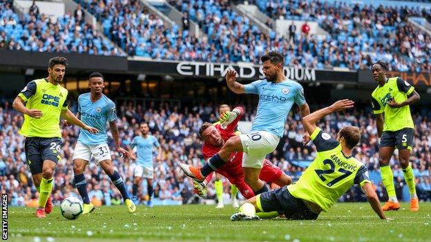 Sergio Aguero scores for Manchester City against Huddersfield