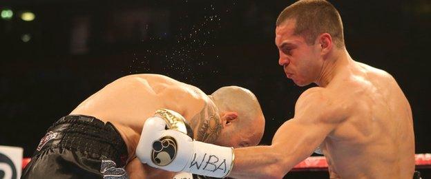 Bury fighter Scott Quigg lands a body punch in the brief contest with Kiko Martinez