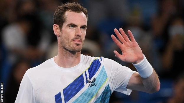 Andy Murray waves after winning his first round match at the Sydney Tennis Classic