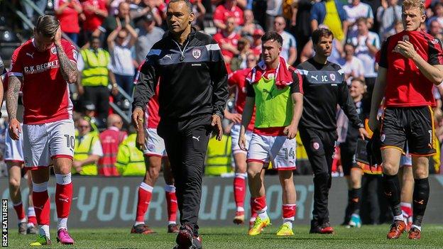 Barnsley's players and staff trudge off the Pride Park pitch after their relegation is confirmed