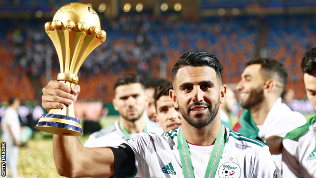 Algeria and Manchester City's Riyad Mahrez with the Africa Cup of Nations trophy